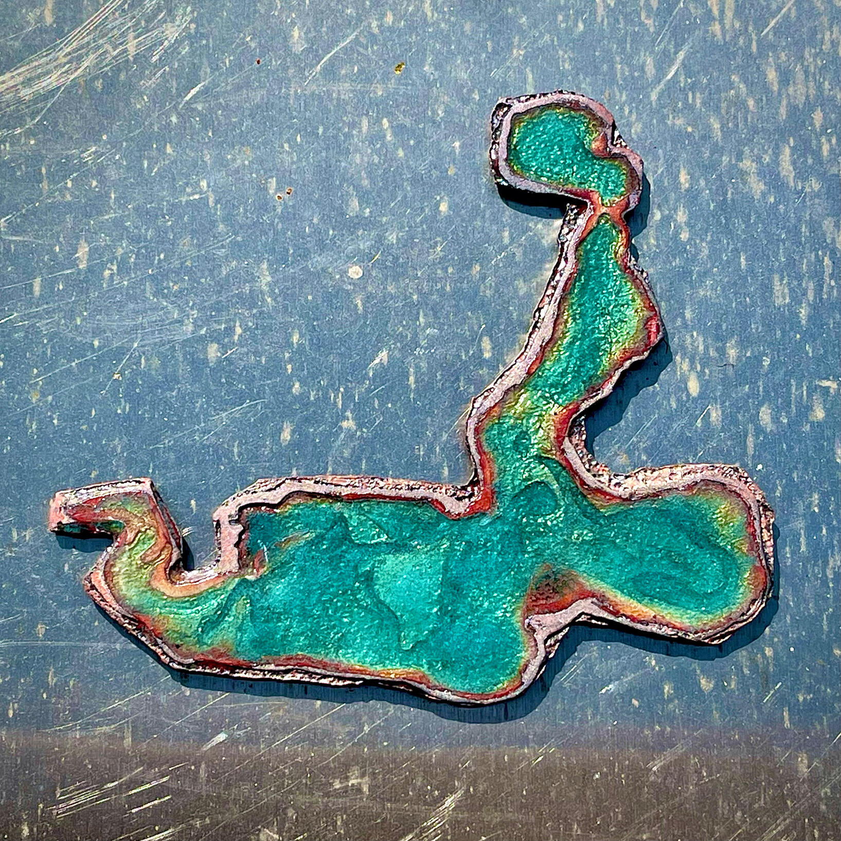 Something on your shirt fork with macaroni and hot sauce brooch